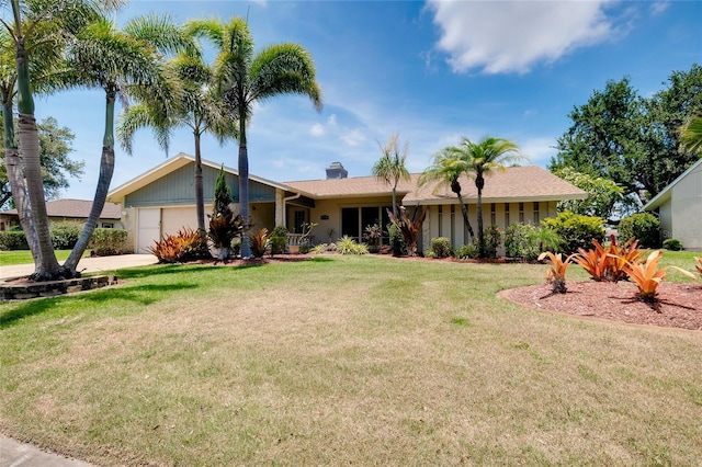 915 S Doral Ln, Venice, FL 34293 - ranch-style house with an attached garage, a front lawn, and a chimney
