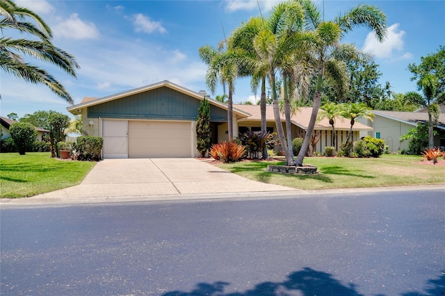 915 S Doral Ln, Venice, FL 34293 - view of front of house with a garage, concrete driveway, and a front yard
