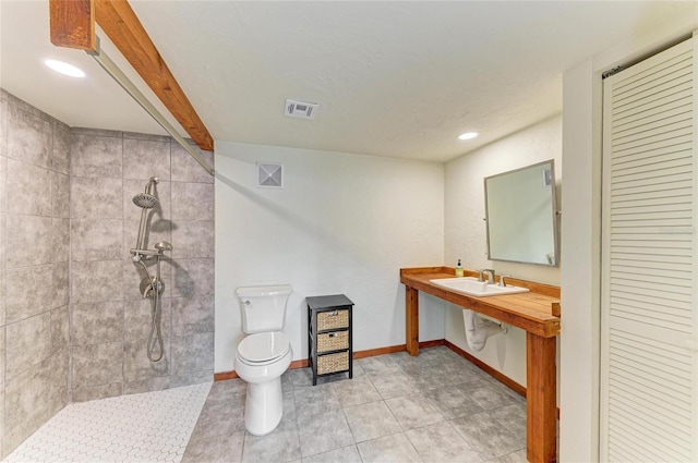 618 Bird Bay Dr S Unit 110, Venice, FL 34285 - bathroom with toilet, a tile shower, baseboards, a closet, and recessed lighting