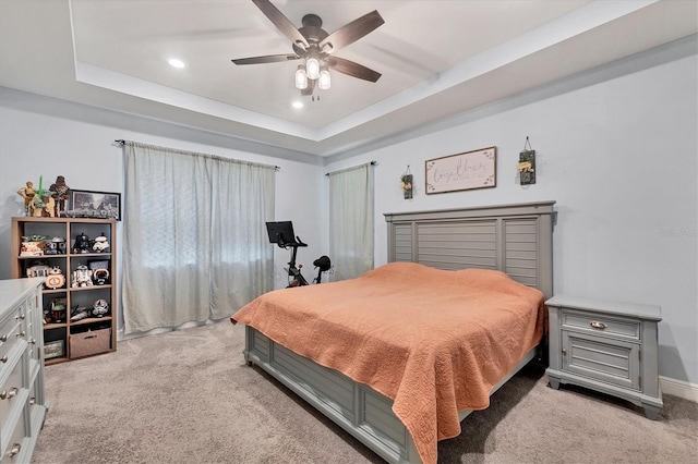 2034 Mesic Hammock Way, Venice, FL 34292 - bedroom with light colored carpet, recessed lighting, a tray ceiling, and a ceiling fan