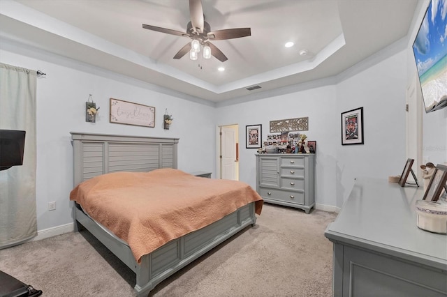2034 Mesic Hammock Way, Venice, FL 34292 - bedroom featuring light carpet, a tray ceiling, recessed lighting, baseboards, and ceiling fan