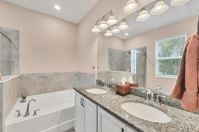 2034 Mesic Hammock Way, Venice, FL 34292 - bathroom featuring a stall shower, a garden tub, and double vanity