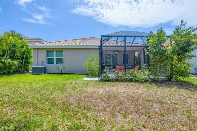2034 Mesic Hammock Way, Venice, FL 34292 - rear view of property featuring stucco siding, a lawn, ceiling fan, a patio area, and a tile roof