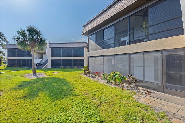 1728 S Lakeside Ct Unit 1720B, Venice, FL 34293 - view of grassy yard with a sunroom