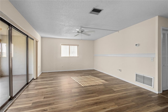 1728 S Lakeside Ct Unit 1720B, Venice, FL 34293 - spare room featuring a textured ceiling, ceiling fan, wood finished floors, and baseboards