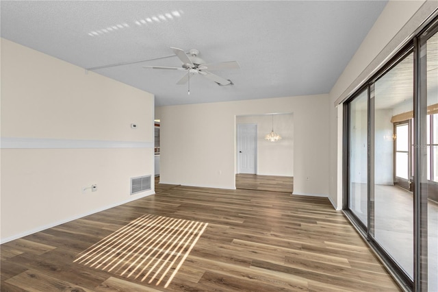 1728 S Lakeside Ct Unit 1720B, Venice, FL 34293 - empty room featuring wood finished floors, a chandelier, ceiling fan, and baseboards