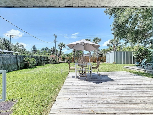 413 Valencia Rd, Venice, FL 34285 - wooden terrace with outdoor dining space