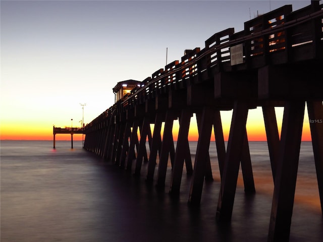 413 Valencia Rd, Venice, FL 34285 - property at dusk with a pier and a water view