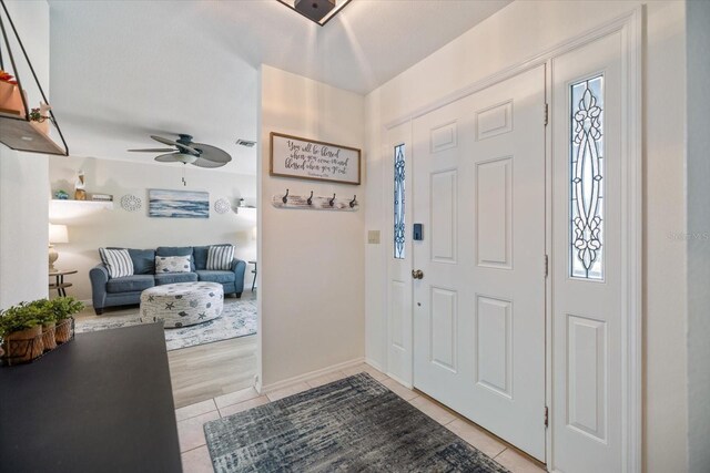 9277 Saint Catherine Ave, Englewood, FL 34224 - entrance foyer featuring light tile patterned floors and a ceiling fan
