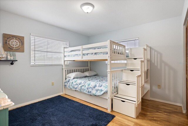 9277 Saint Catherine Ave, Englewood, FL 34224 - bedroom with wood finished floors and baseboards