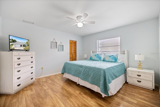 9277 Saint Catherine Ave, Englewood, FL 34224 - bedroom featuring light wood finished floors, baseboards, a closet, and ceiling fan