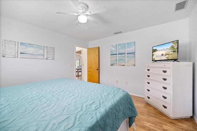 9277 Saint Catherine Ave, Englewood, FL 34224 - bedroom featuring light wood-type flooring, a ceiling fan, and baseboards