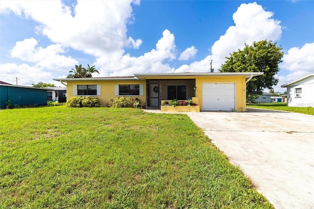 306 E Penn Rd, Lehigh Acres, FL 33936 - ranch-style house with an attached garage, driveway, and a front yard