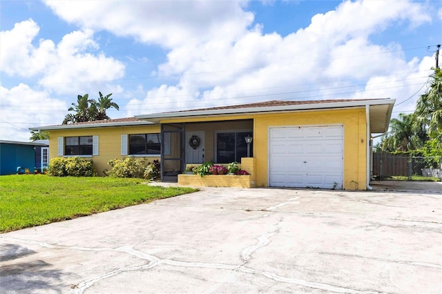 306 E Penn Rd, Lehigh Acres, FL 33936 - ranch-style house featuring a garage and concrete driveway