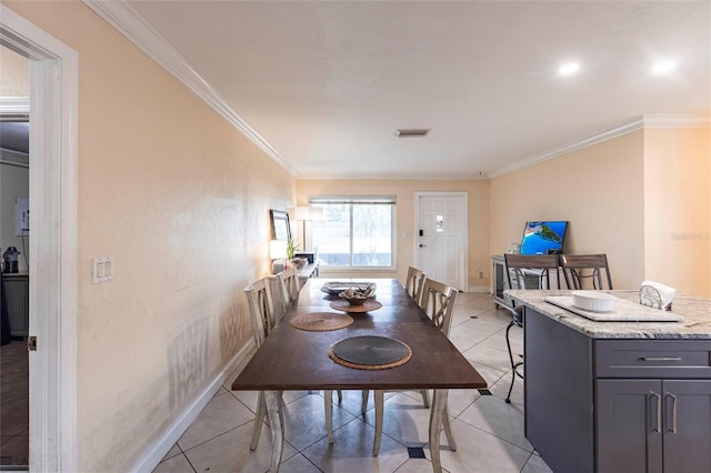 306 E Penn Rd, Lehigh Acres, FL 33936 - dining space featuring ornamental molding, light tile patterned floors, and baseboards