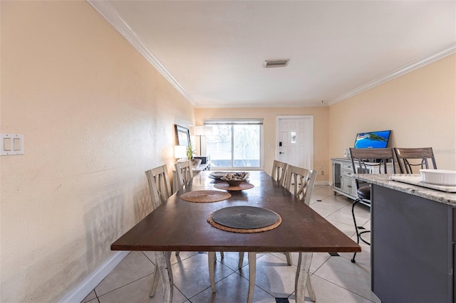 306 E Penn Rd, Lehigh Acres, FL 33936 - dining space featuring ornamental molding, light tile patterned floors, and baseboards