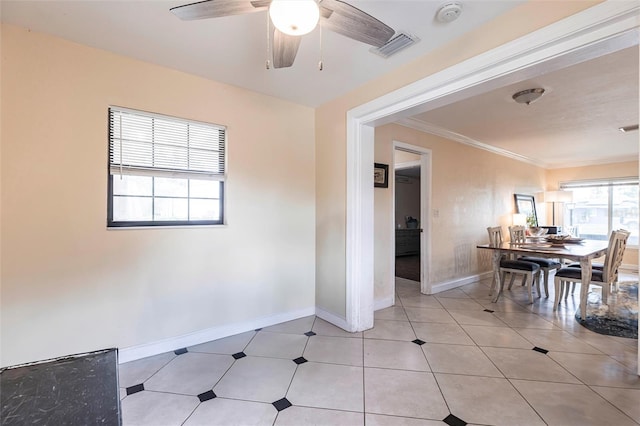 306 E Penn Rd, Lehigh Acres, FL 33936 - dining space with baseboards, ornamental molding, ceiling fan, and light tile patterned floors