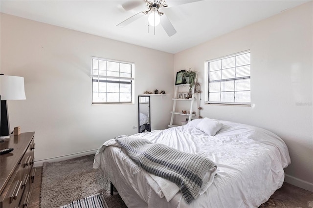 306 E Penn Rd, Lehigh Acres, FL 33936 - bedroom featuring multiple windows, baseboards, and ceiling fan