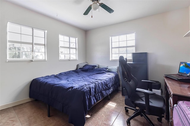306 E Penn Rd, Lehigh Acres, FL 33936 - tiled bedroom with an office area, a ceiling fan, and baseboards