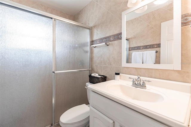 306 E Penn Rd, Lehigh Acres, FL 33936 - full bath featuring tile walls, a shower stall, toilet, and vanity