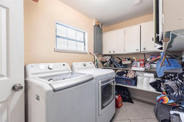306 E Penn Rd, Lehigh Acres, FL 33936 - laundry room with washer and dryer, cabinet space, light tile patterned flooring, and electric panel
