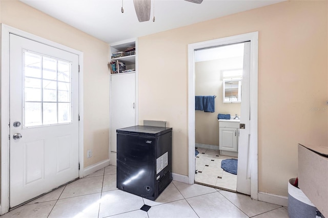 306 E Penn Rd, Lehigh Acres, FL 33936 - entryway featuring a ceiling fan, baseboards, and light tile patterned floors