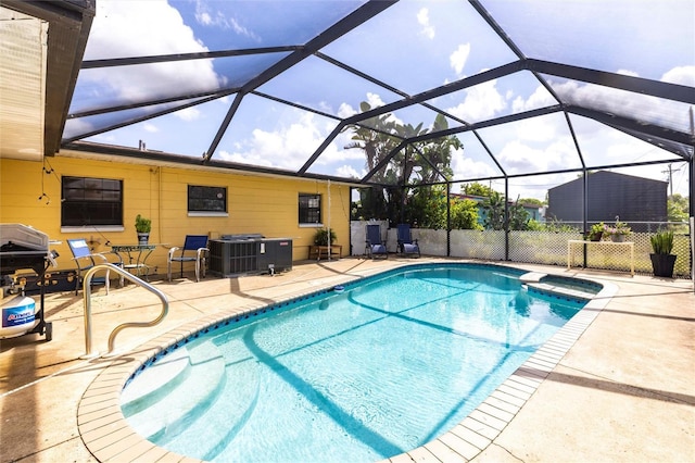 306 E Penn Rd, Lehigh Acres, FL 33936 - view of pool featuring central AC unit, a patio, a pool with connected hot tub, and grilling area