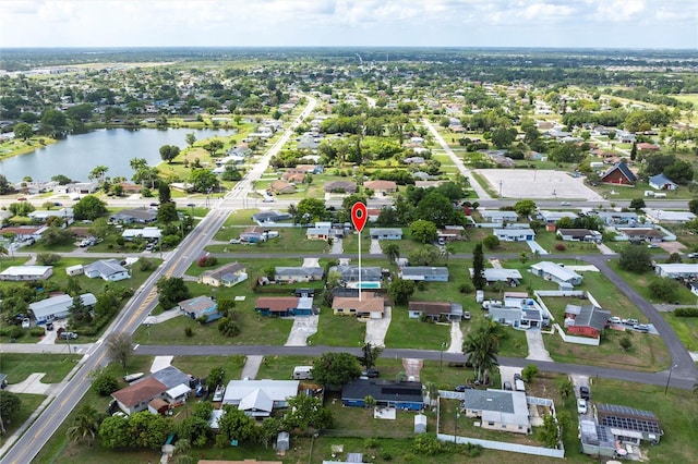 306 E Penn Rd, Lehigh Acres, FL 33936 - aerial view of property and surrounding area featuring a large body of water and nearby suburban area