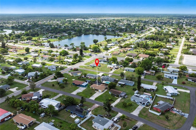 306 E Penn Rd, Lehigh Acres, FL 33936 - aerial view of property and surrounding area featuring a large body of water and nearby suburban area