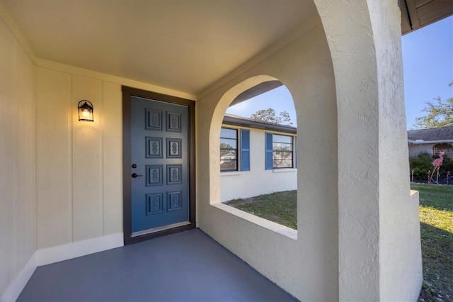 1032 Elaine St, Venice, FL 34285 - view of exterior entry with stucco siding