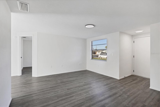 1032 Elaine St, Venice, FL 34285 - empty room with dark wood-style flooring and baseboards