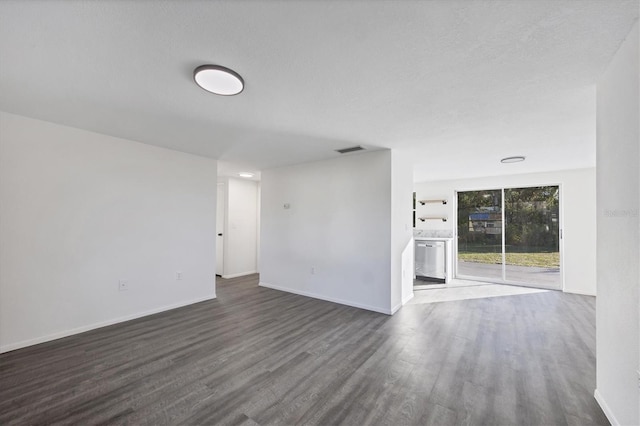 1032 Elaine St, Venice, FL 34285 - empty room featuring dark wood-style floors and baseboards