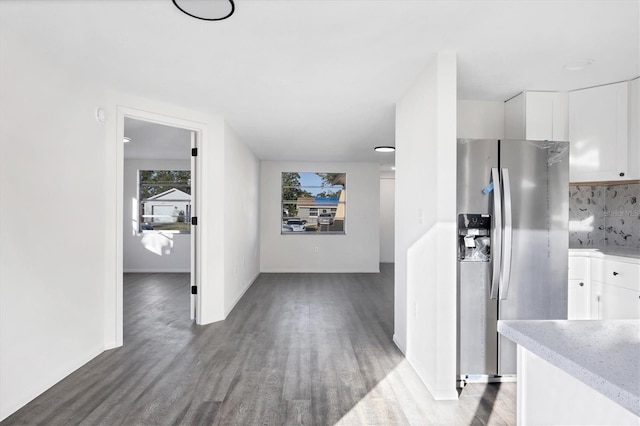 1032 Elaine St, Venice, FL 34285 - kitchen featuring stainless steel fridge, white cabinetry, wood finished floors, backsplash, and light stone countertops