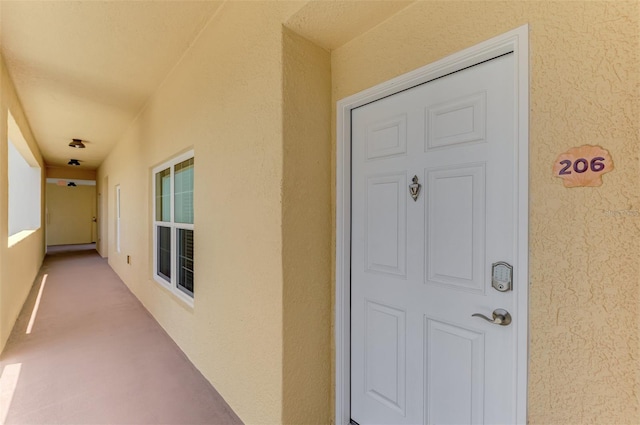 8409 Placida Rd Unit 206, Placida, FL 33946 - view of exterior entry featuring stucco siding