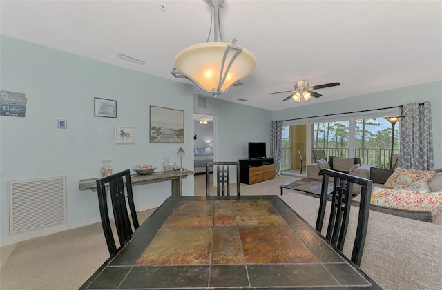 8409 Placida Rd Unit 206, Placida, FL 33946 - dining area featuring a ceiling fan, baseboards, and carpet