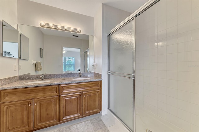 8409 Placida Rd Unit 206, Placida, FL 33946 - full bathroom with a shower stall, double vanity, and tile patterned floors
