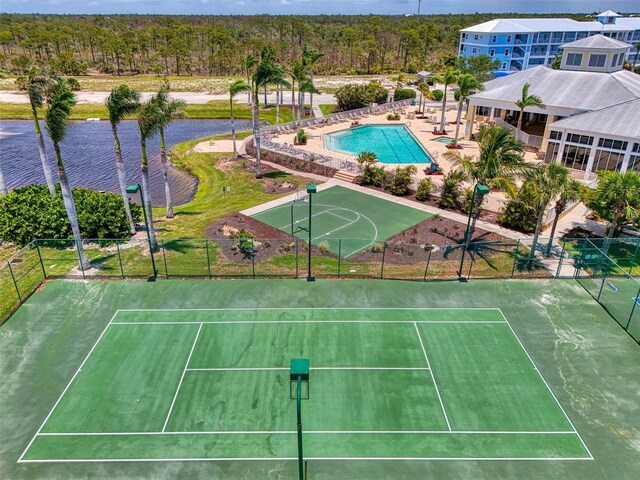 8409 Placida Rd Unit 206, Placida, FL 33946 - view of sport court with a community pool, a tennis court, and a water view