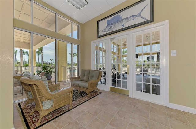 8409 Placida Rd Unit 206, Placida, FL 33946 - sunroom with french doors and baseboards