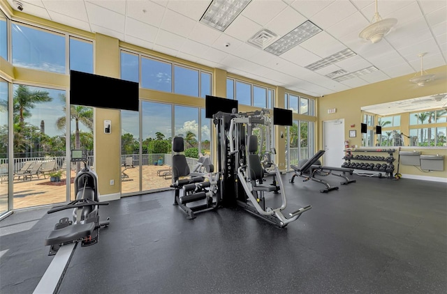8409 Placida Rd Unit 206, Placida, FL 33946 - workout area with a towering ceiling, a drop ceiling, and baseboards