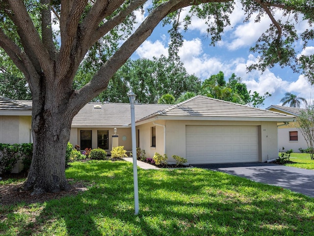 114 Southampton Pl N Unit 237, Venice, FL 34293 - single story home with a garage, driveway, a front lawn, and stucco siding
