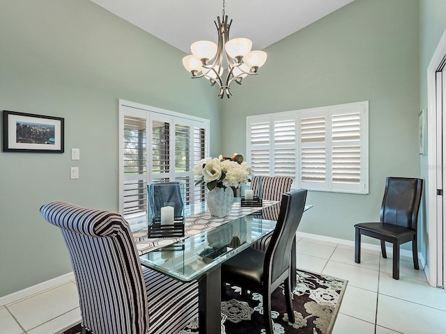 114 Southampton Pl N Unit 237, Venice, FL 34293 - dining space featuring a chandelier, baseboards, light tile patterned flooring, and high vaulted ceiling