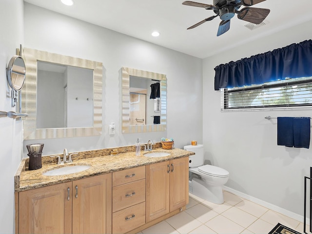 114 Southampton Pl N Unit 237, Venice, FL 34293 - full bath with toilet, double vanity, a ceiling fan, tile patterned floors, and baseboards