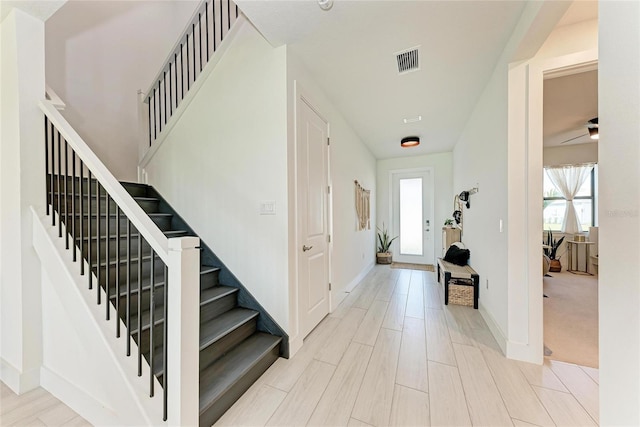 12816 Morning Mist Pl, Venice, FL 34293 - foyer entrance featuring plenty of natural light, stairs, and baseboards