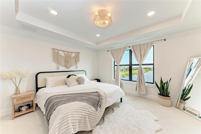 12816 Morning Mist Pl, Venice, FL 34293 - bedroom with a raised ceiling, light colored carpet, baseboards, and recessed lighting