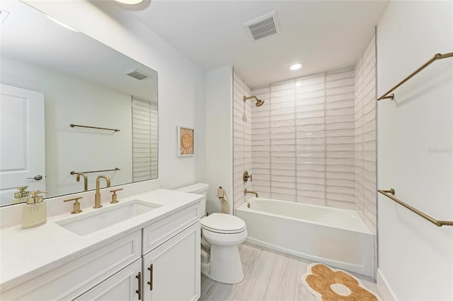 12816 Morning Mist Pl, Venice, FL 34293 - bathroom with vanity, toilet, bathing tub / shower combination, and recessed lighting