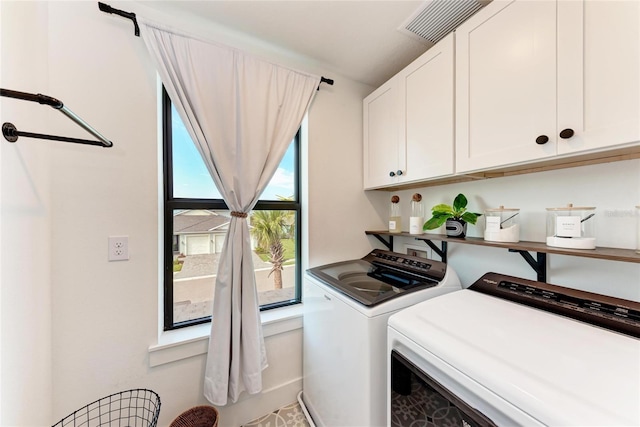 12816 Morning Mist Pl, Venice, FL 34293 - laundry room with cabinet space and independent washer and dryer