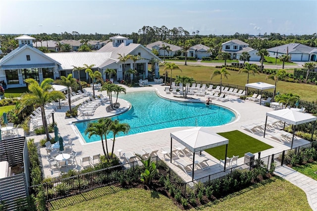 12816 Morning Mist Pl, Venice, FL 34293 - community pool featuring a residential view and a patio