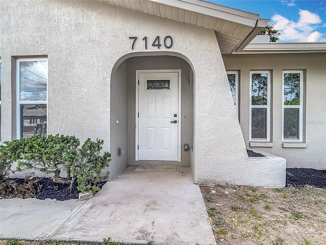 7140 Teaberry St, Englewood, FL 34224 - view of exterior entry with stucco siding