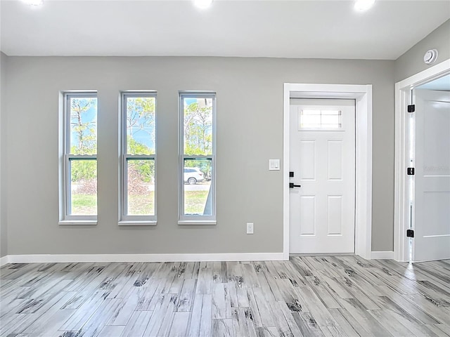 7140 Teaberry St, Englewood, FL 34224 - entryway with light wood-type flooring, baseboards, and recessed lighting