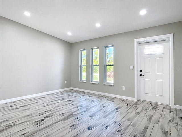 7140 Teaberry St, Englewood, FL 34224 - foyer entrance with light wood finished floors, baseboards, and recessed lighting